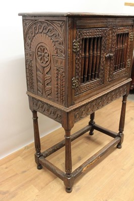 Lot 1444 - Antique oak food hutch enclosed by a pair of bared doors, on carved frieze and fluted turned supports united by stretchers, early elements probably with alterations, 80cm wide x 40cm deep x 121cm h...
