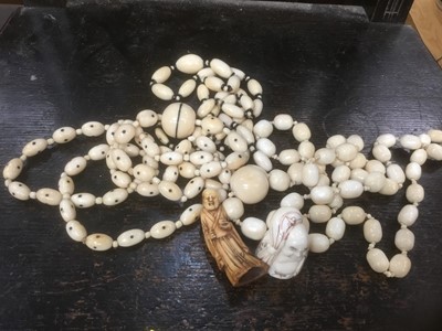 Lot 315 - Collection of ivory necklets and small statue