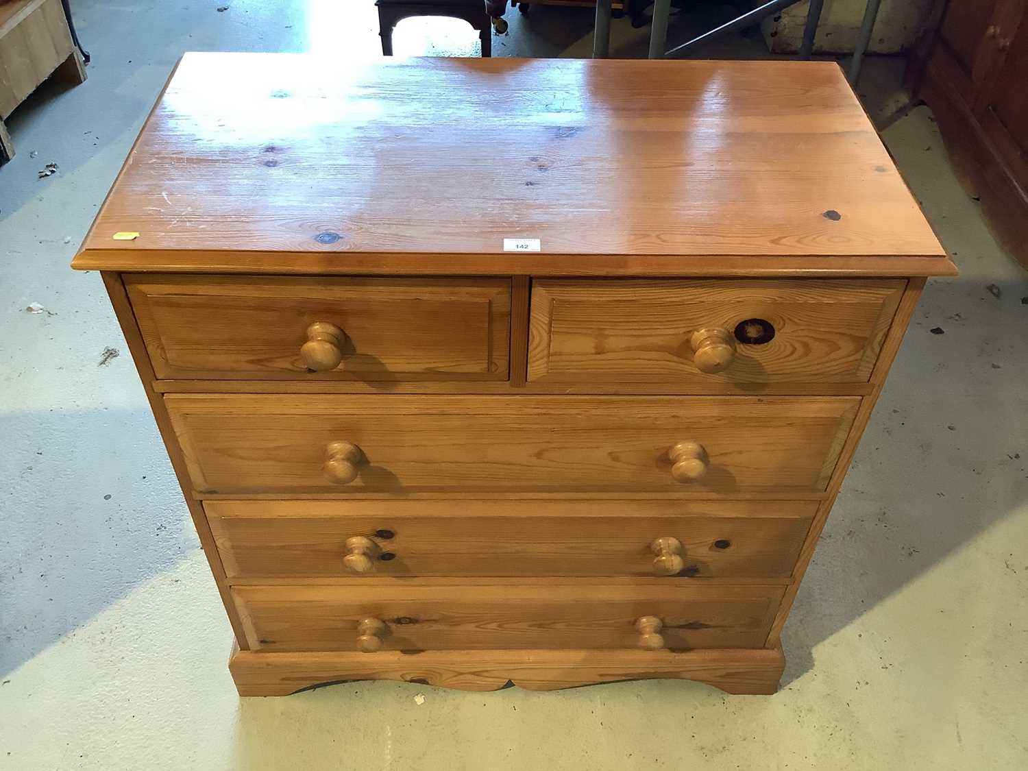 Lot 142 - Pine chest of two short and three long drawers, 90cm wide x 45cm deep x 94cm high and a pair of pine three drawer bedside chests