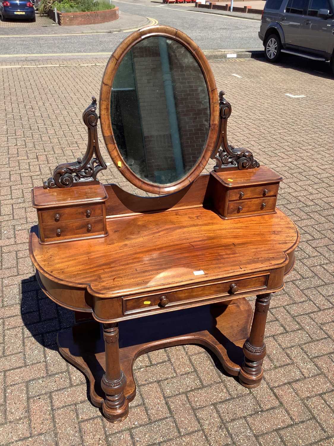 Lot 147 - Victorian mahogany dressing table with raised mirror back and drawers below on turned front legs joined by shaped stretcher, 121cm wide x 58cm deep