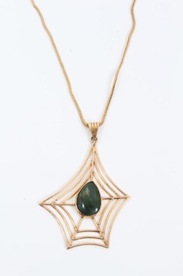 Lot 169 - Yellow metal spider’s web pendant with green agate centre stone on 18ct gold chain