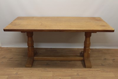 Lot 1296 - Robert Mouseman Thompson carved oak refectory table, rounded rectangular adzed top on facetted ends and sledge base united by a foot stretcher. signature mouse to one pedestal, 86 x 170cm