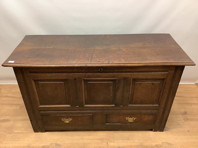 Lot 1097 - Early 18th century oak mule chest, with hinged lid enclosed interior with candle box, two drawers below the triple fielded panel front, on stiles, 135cm wide x 53cm deep x 79cm high