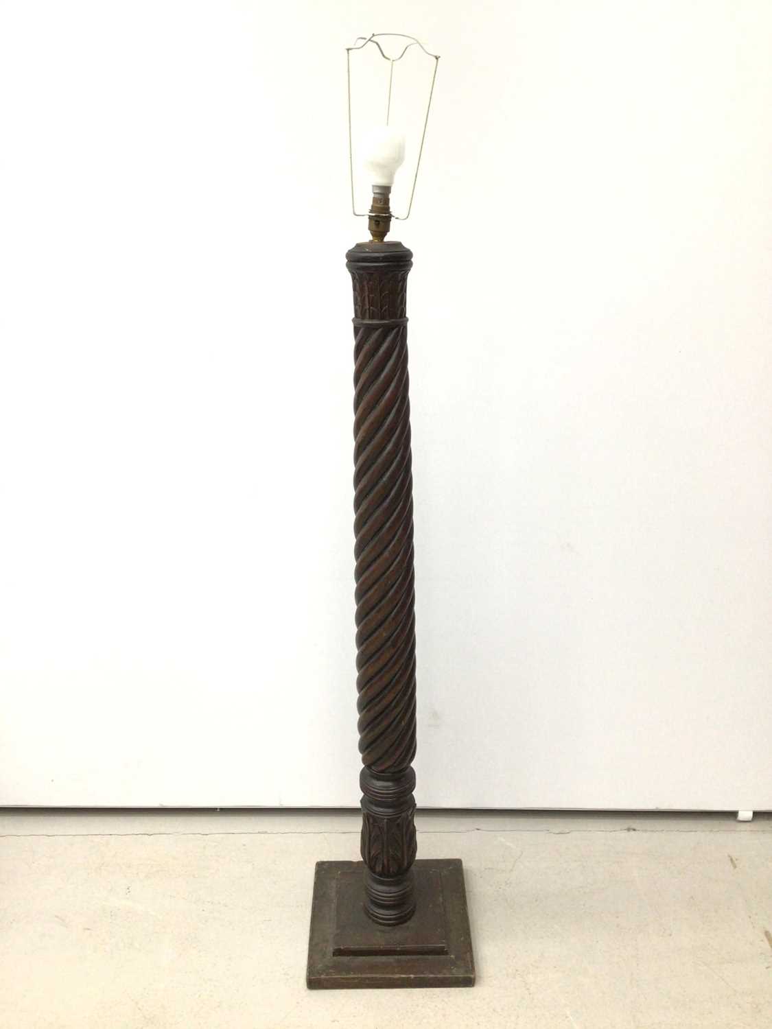 Lot 184 - Three various mahogany standard lamps with spiral columns, two on tripod bases