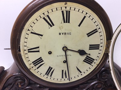 Lot 766 - Large Victorian boardroom clock retailed by Byrne, Liverpool with painted dial, Winterhauser& Huffmeyer 8 day movement with Westminster chimes and gongs with repeat action, scroll carved decoration...