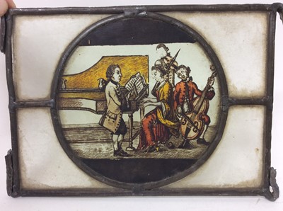 Lot 991 - Four 18th / 19th century stained glass panels, each with a circular reserve depicting figures representing an artist, a sculptor, a teacher and a musician. Each approximately 14.5cm x 19.5cm.