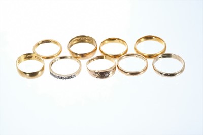 Lot 676 - Eight gold rings to include five 22ct gold wedding rings, an 18ct gold diamond half eternity ring, Victorian 15ct gold diamond gypsy ring, 9ct gold wedding ring and a gilt metal ring.