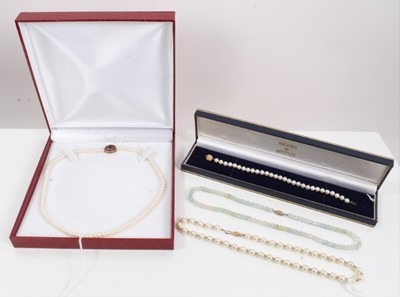 Lot 189 - Cultured pearl necklace with 9ct gold purple stone flower head clasp, one other cultured pearl necklace and bracelet, both with 9ct gold clasps and a faceted glass bead necklace (4)