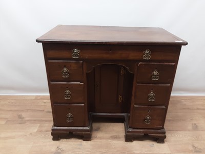 Lot 942 - George II mahogany kneehole desk, the crossbanded top with re-entrant corners