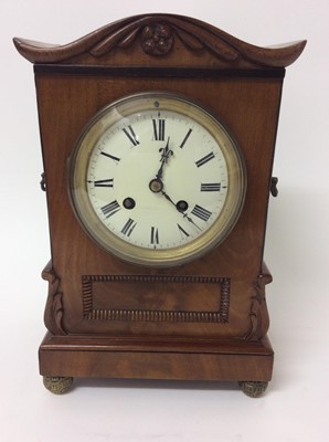 Lot 770 - 19th century mantle clock with French movement striking on bell in Regency flame mahogany case on gilt brass ball feet 28cm high, pendulum present