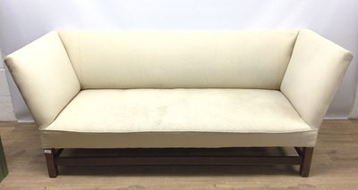 Lot 1531 - George III style sofa upholstered in cream material on mahogany square chamfered legs joined by stretchers