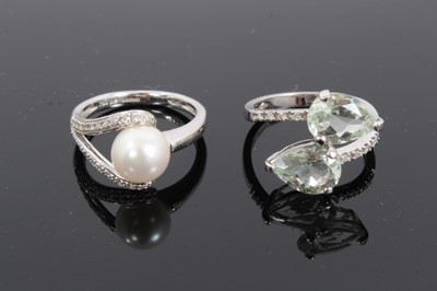 Lot 191 - 18ct white gold cultured pearl ring and one other gem set crossover ring