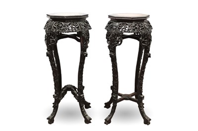 Lot 1539 - Pair of late 19th / early 20th century marble topped carved hardwood urn stands, each of octagonal form with beaded edge and pierced frieze on slender cabriole legs, 91cm high