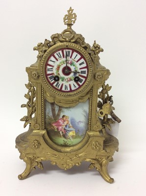 Lot 776 - Two late 19th century French gilt metal and porcelain mounted mantel clocks decorated with romantic scenes ,36 and 38 cm high, both with keys and pendulums  (2)