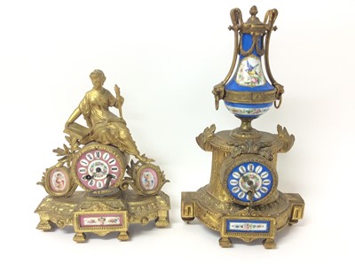 Lot 777 - Two late 19th century French gilt metal and porcelain mounted mantel clocks with cherub and bird decoration , one with urn mount, the other with classical female mount 33-42 cm , both with keys but...