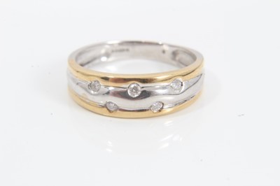 Lot 195 - 18ct white and yellow gold triple band ring set with five brilliant cut diamonds