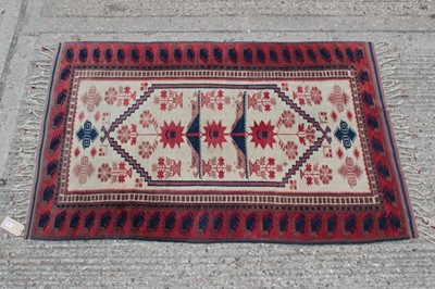 Lot 1556 - Modern Persian-style rug with red and blue geometric pattern on cream ground, approximately 185cm x 115cm