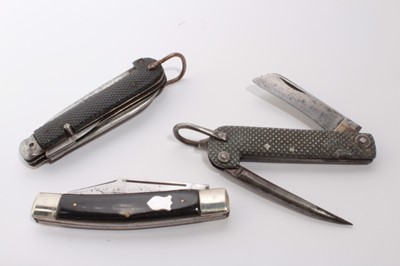 Lot 891 - Good quality horn mounted three bladed folding pocket knife, stamped CK and named on blade 'Premium Stock Knife' together with two British military folding pocket knives with checkered grips (3)