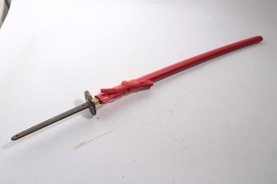 Lot 899 - Good quality contemporary Japanese Katana sword with curved watered steel blade, the tang unsigned, in red laquer scbbard, the blade 70cm in length (excluding tang)