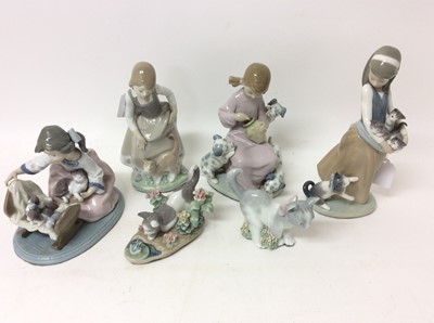 Lot 1096 - Four Lladro or Nao porcelain figures and two cats