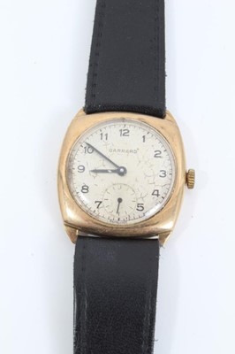 Lot 210 - 9ct gold vintage Garrard wristwatch on black leather strap