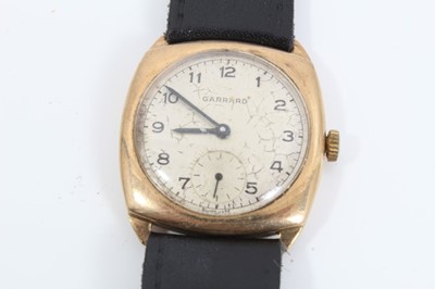 Lot 210 - 9ct gold vintage Garrard wristwatch on black leather strap