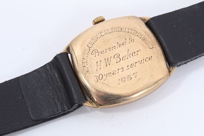 Lot 210 - 9ct gold vintage Garrard wristwatch on black leather strap