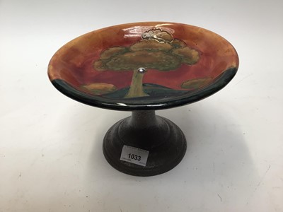 Lot 1033 - Moorcroft pottery flambe tazza decorated with trees in landscape on pewter base, impressed marks, 22cm diameter, 15cm high