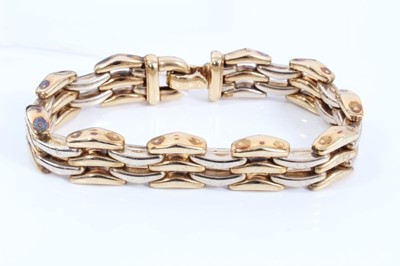 Lot 227 - 9ct two colour gold triple row flat link bracelet