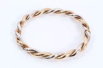 Lot 228 - 9ct two colour gold twisted bangle