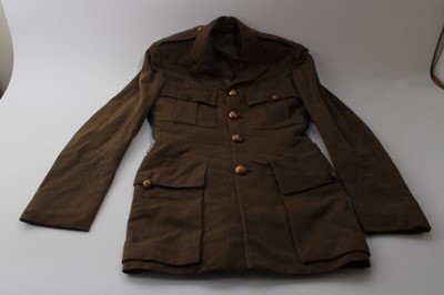 Lot 833 - Post War British military uniform to include service dress jacket by Audsley, Harrogate, together with another similar jacket and trousers, in a suitcase.