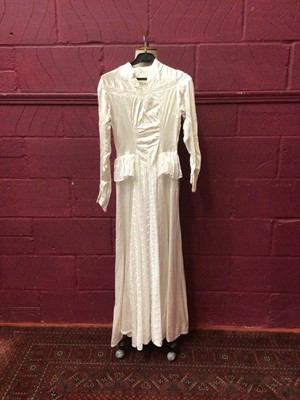 Lot 2155 - Three vintage wedding dresses, including 1950s satin and lace, 1980s Oyster satin, pointed waistline and rosetts on dropped shoulders by Berkertex, a cream satin dress with heavily beaded bodice...