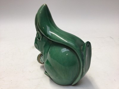 Lot 1069 - Rare 1930s Denby Velray green glazed squirrel with stopper