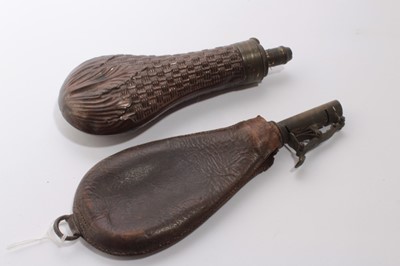 Lot 996 - 19th century copper powder flask by Dixon & Sons, with simulated basket weave decoration, together with a leather shot flask (2)