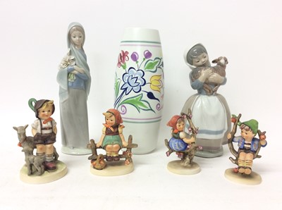 Lot 1082 - Four Hummel figures including Apple Tree Boy and Girl, Poole pottery vase and two Spanish figures, possibly Lladro or Nao (7)