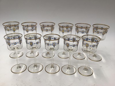 Lot 1089 - Set of six good quality wine glasses decorated with blue and gilt floral band and gilt rims, 18cm high, and five matching smaller glasses (11)