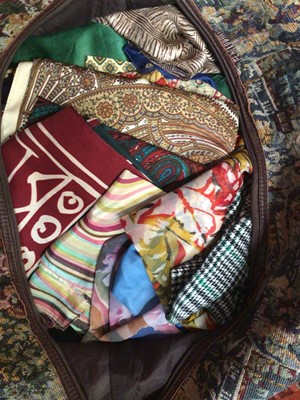 Lot 1987 - A quantity of vintage scarves, wool, silk cotton etc.  Pashmina and silk shawl, Indian hand embroidered wool shawl etc.  Sold in a large tapestry bag.