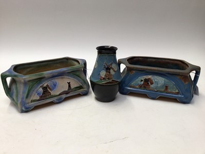 Lot 1092 - 1930s Denby Danesby Ware two handled planter decorated with windmills, 29cm wide, 11.5cm high, another similar and a vase, 18cm high (3)