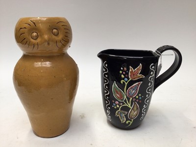 Lot 1094 - Denby black glazed jug with painted leaf decoration, 17.5cm high, four pottery plates with abstract decoration and a Clay Pitts pottery owl jug, 23cm high (6)