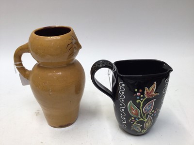 Lot 1094 - Denby black glazed jug with painted leaf decoration, 17.5cm high, four pottery plates with abstract decoration and a Clay Pitts pottery owl jug, 23cm high (6)