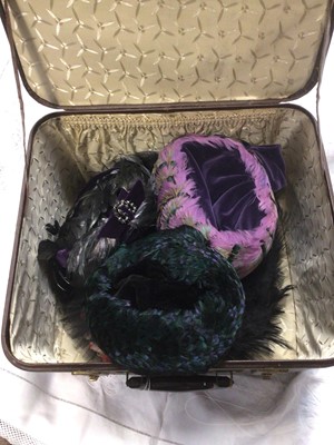 Lot 1989 - A square rexine case containing four vintage feather hats plus one other.