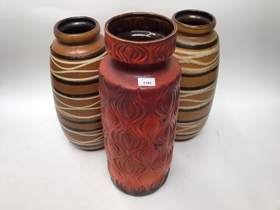 Lot 1101 - Mid 20th century West German pottery vase, numbered 285-53, 54cm high, together with another pair of West German vases, numbered 284-47, 48cm high (3)