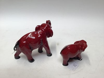 Lot 1106 - Royal Doulton Flambe Elephant and baby Elephant