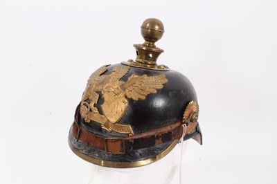 Lot 726 - First World War Baden artillery picklehaub with gilt brass helmet plate, brass ball mount, leather chin strap, national and state cockades, original leather liner, stamped on neck guard' 3 B.F.A.R...