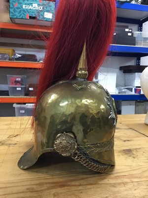 Lot 736 - Victorian Dragoon Guards 1871 Pattern helmet with later alterations, red plume, brass chin chain - lining missing