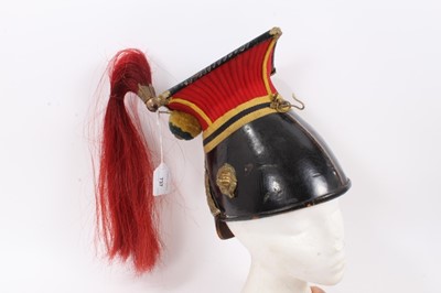 Lot 737 - Scarce late Victorian 12th ( Prince of Wales Own ) troopers' lance cap with embossed brass helmet plate, red and yellow facings, red horsehair plume , brass lions head bosses, original lining - sta...