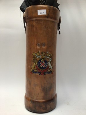 Lot 2275 - Collection of walking sticks and umbrellas in a leather-covered stick stand with crest