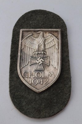 Lot 779 - Second World War Nazi German Shield badge- Cholm 1942, on grey cloth backing