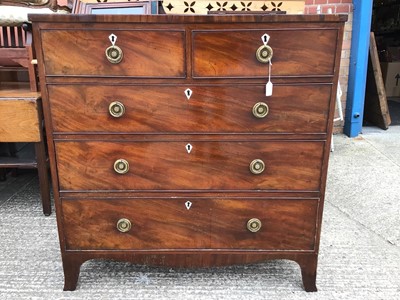 Lot 929 - George III mahogany chest of two short and three long drawers with brass ring handles, on bracket feet