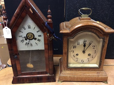 Lot 2355 - Edwardian dome topped mantel clock in oak case, together with a mahogany cased mantel clock of architectural form (2)